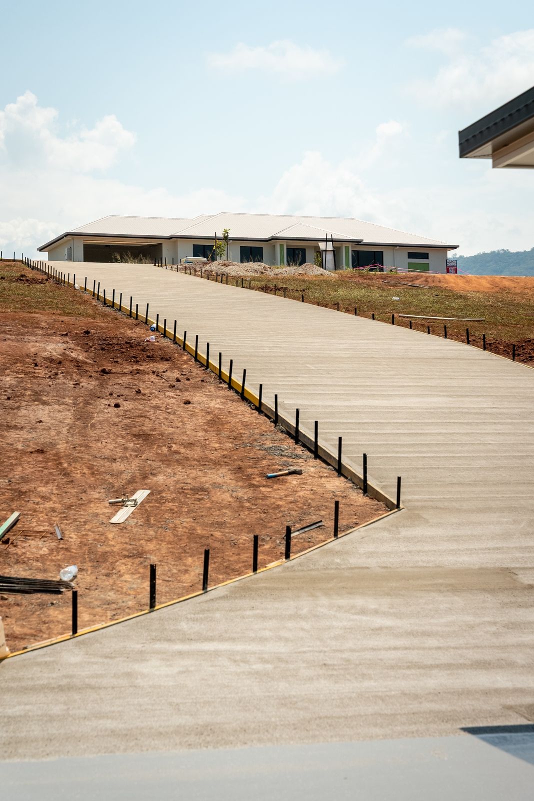Long new driveway running up to a newly built house