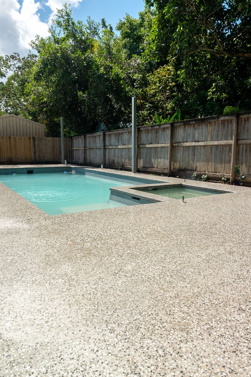 Pool and spa with matching exposed aggregate coping and surround